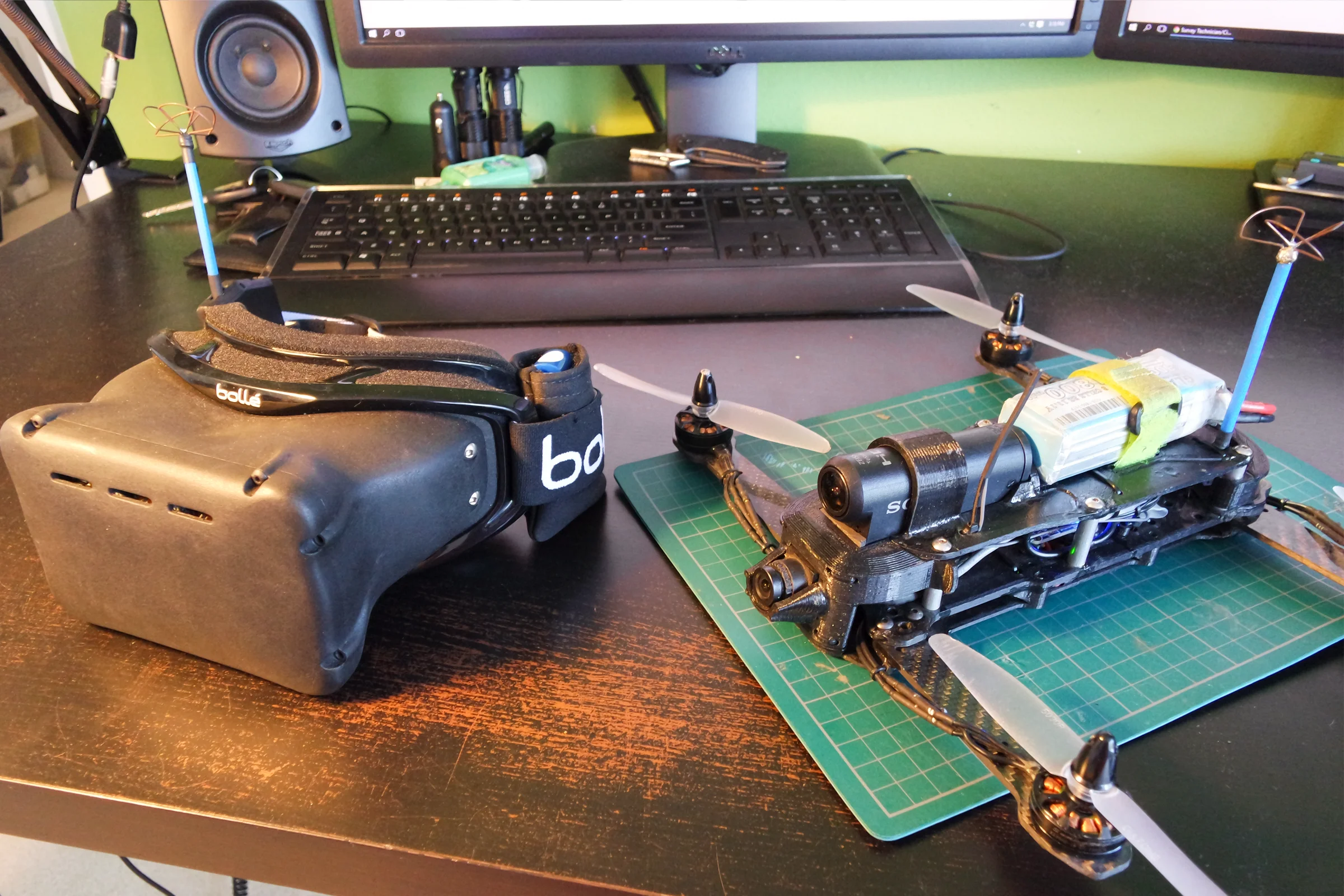 Top-down view of Drone 5 showing the low-profile H-frame, carbon fiber motor arms, and the Sony Actioncam integrated flush into the chassis