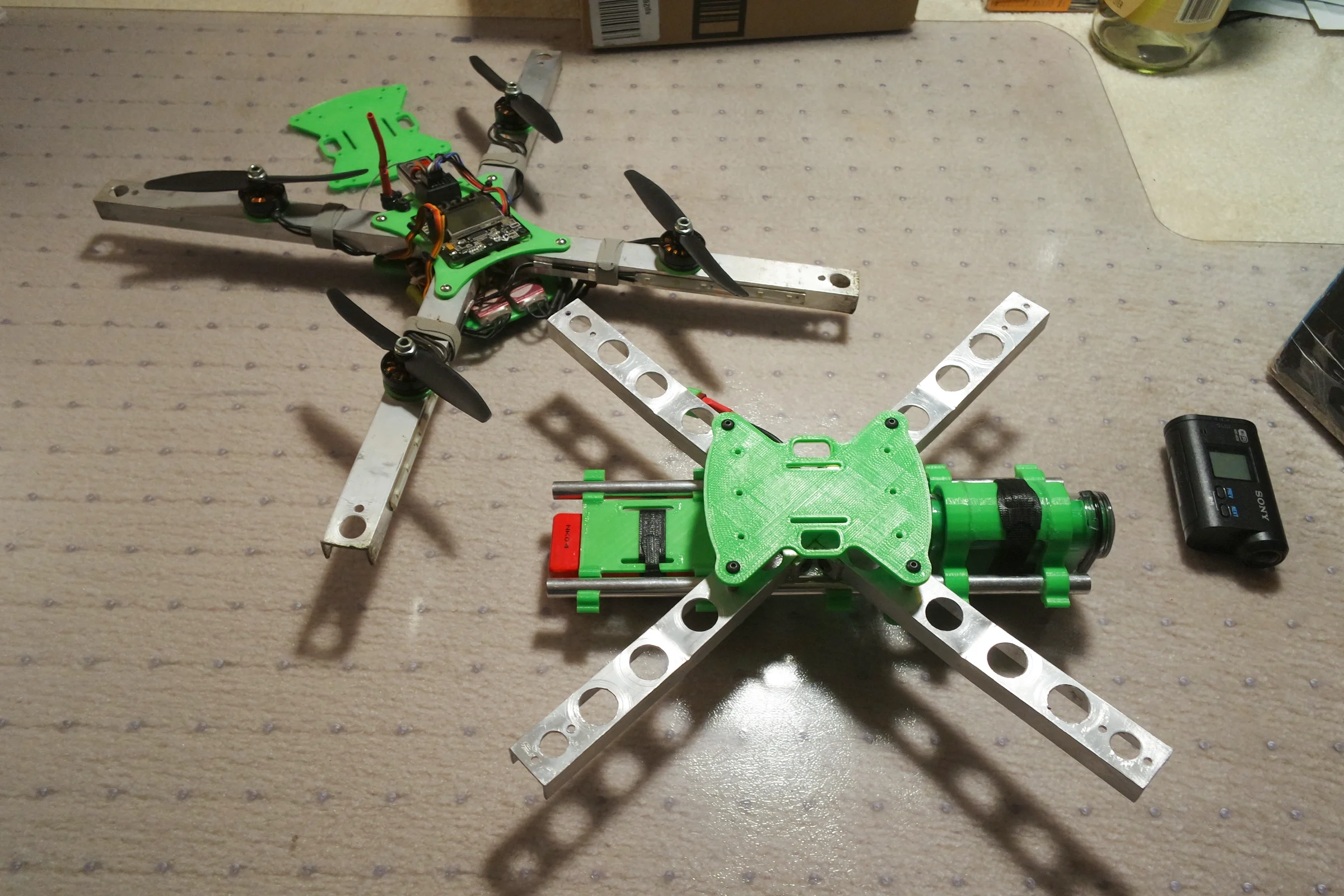FPV Platforms and Goggle System — Drone 4 X-frame assembled showing dihedral arm bend with inward motor tilt