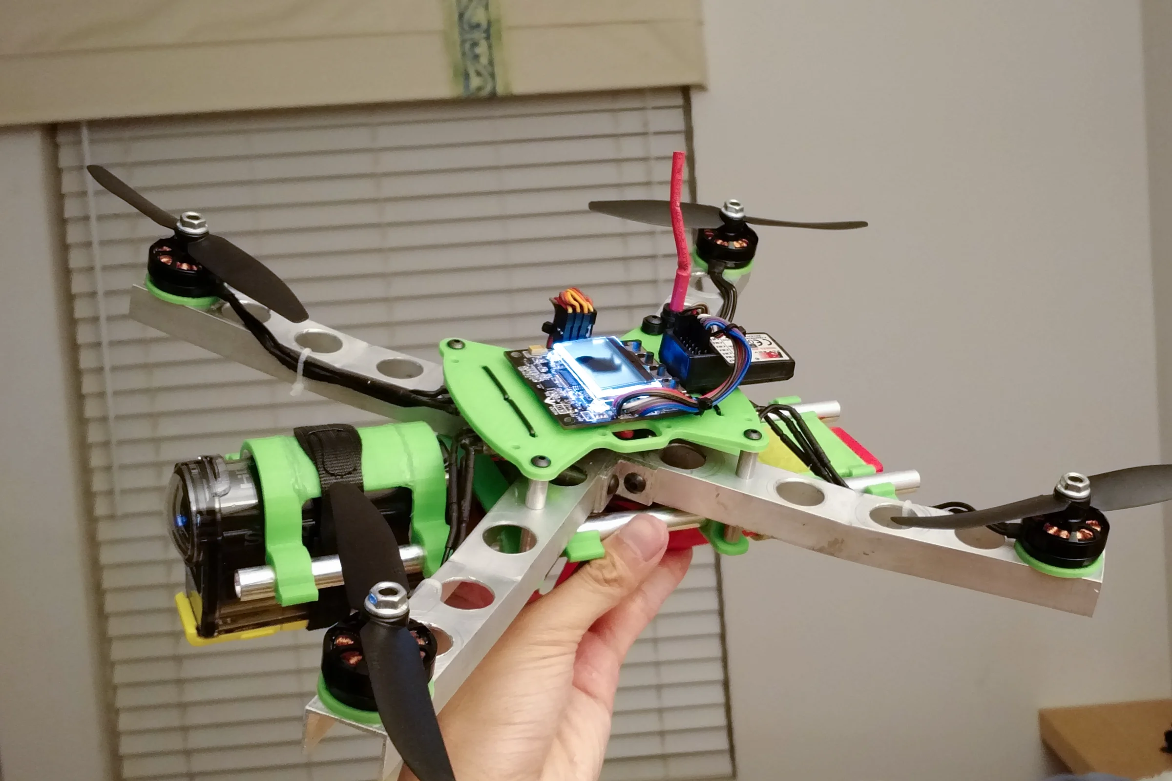 FPV Platforms and Goggle System — Drone 4 CAD showing dihedral arm angles and weight reduction hole pattern
