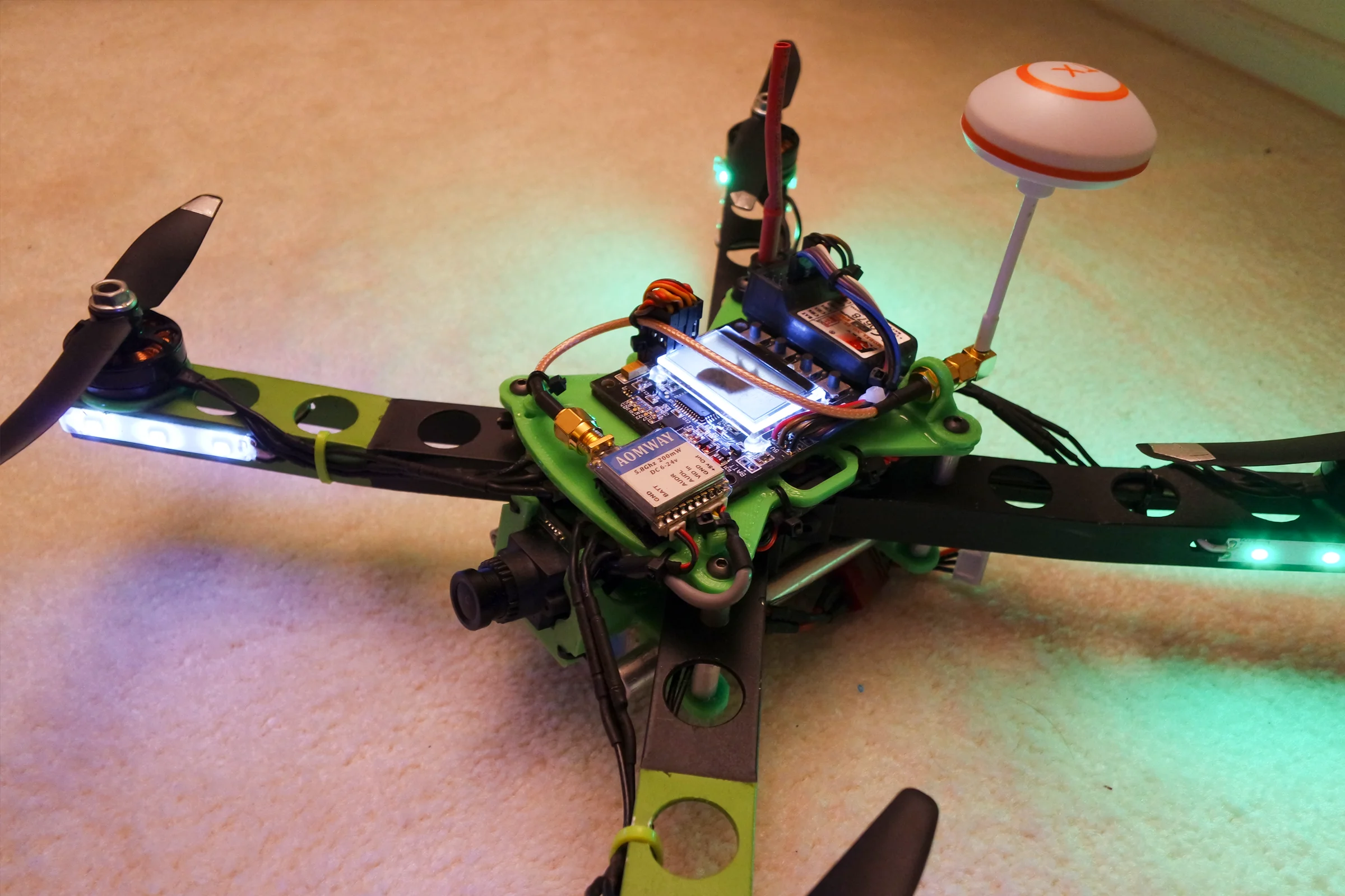 FPV Platforms and Goggle System — Drone 4 dihedral aluminum X-frame in flight with FPV hardware