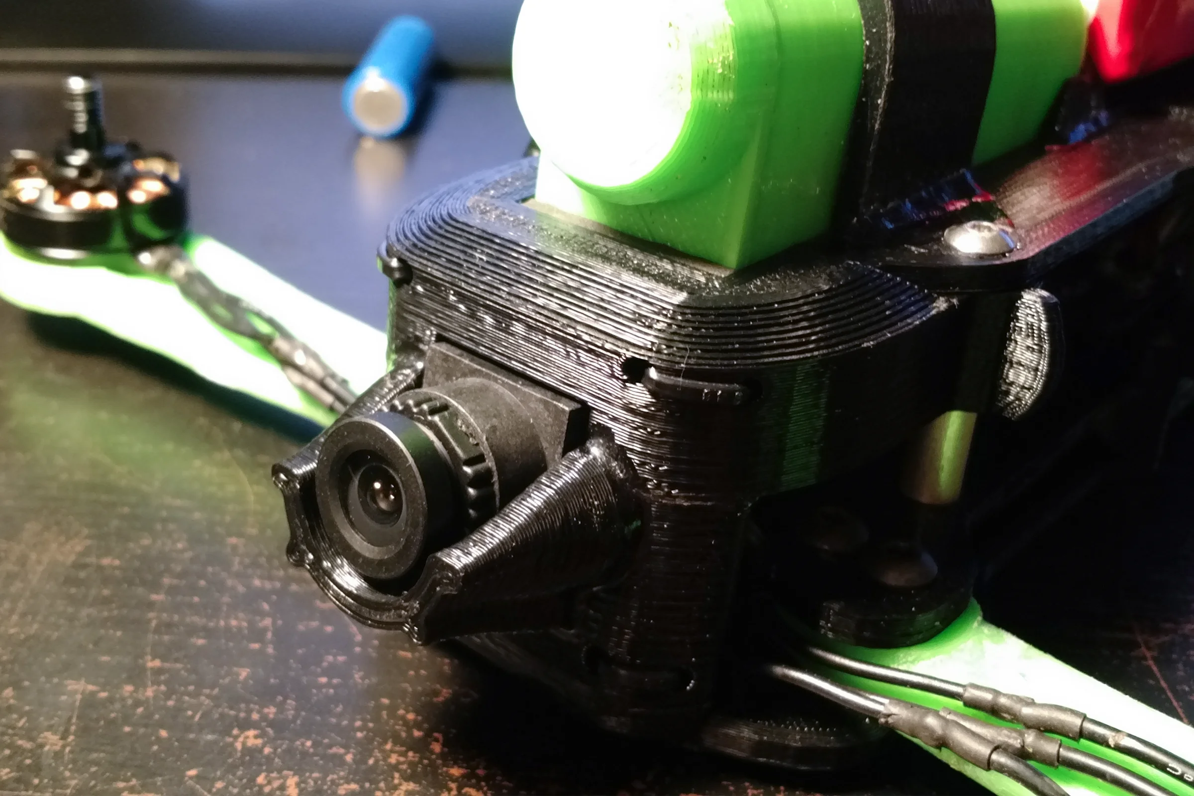 FPV Platforms and Goggle System — Drone 5 fully assembled with CF arms, integrated Actioncam, and FPV board cam in front retaining clip