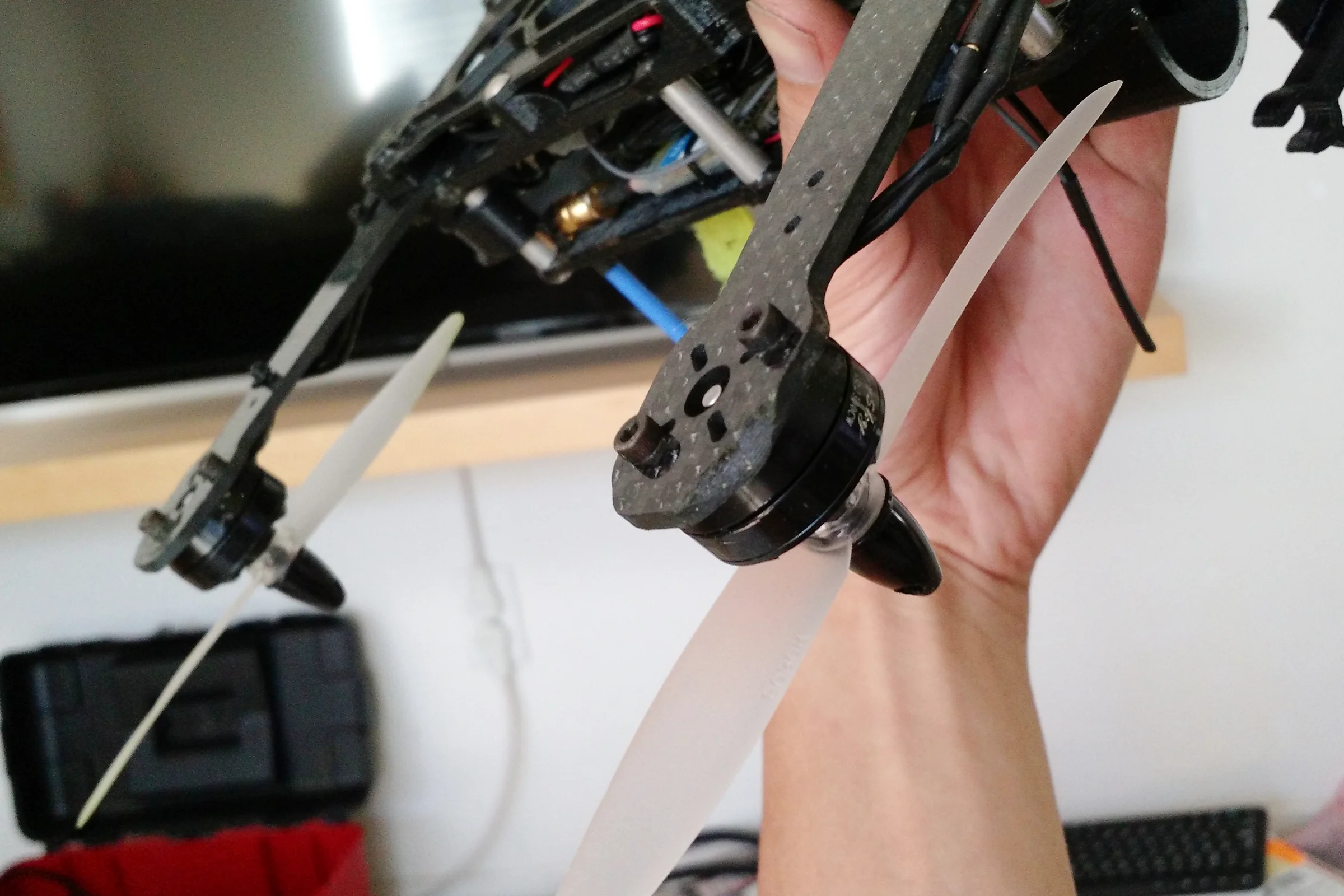 FPV Platforms and Goggle System — Drone 5 fully assembled with CF arms, integrated Actioncam, and FPV board cam in front retaining clip
