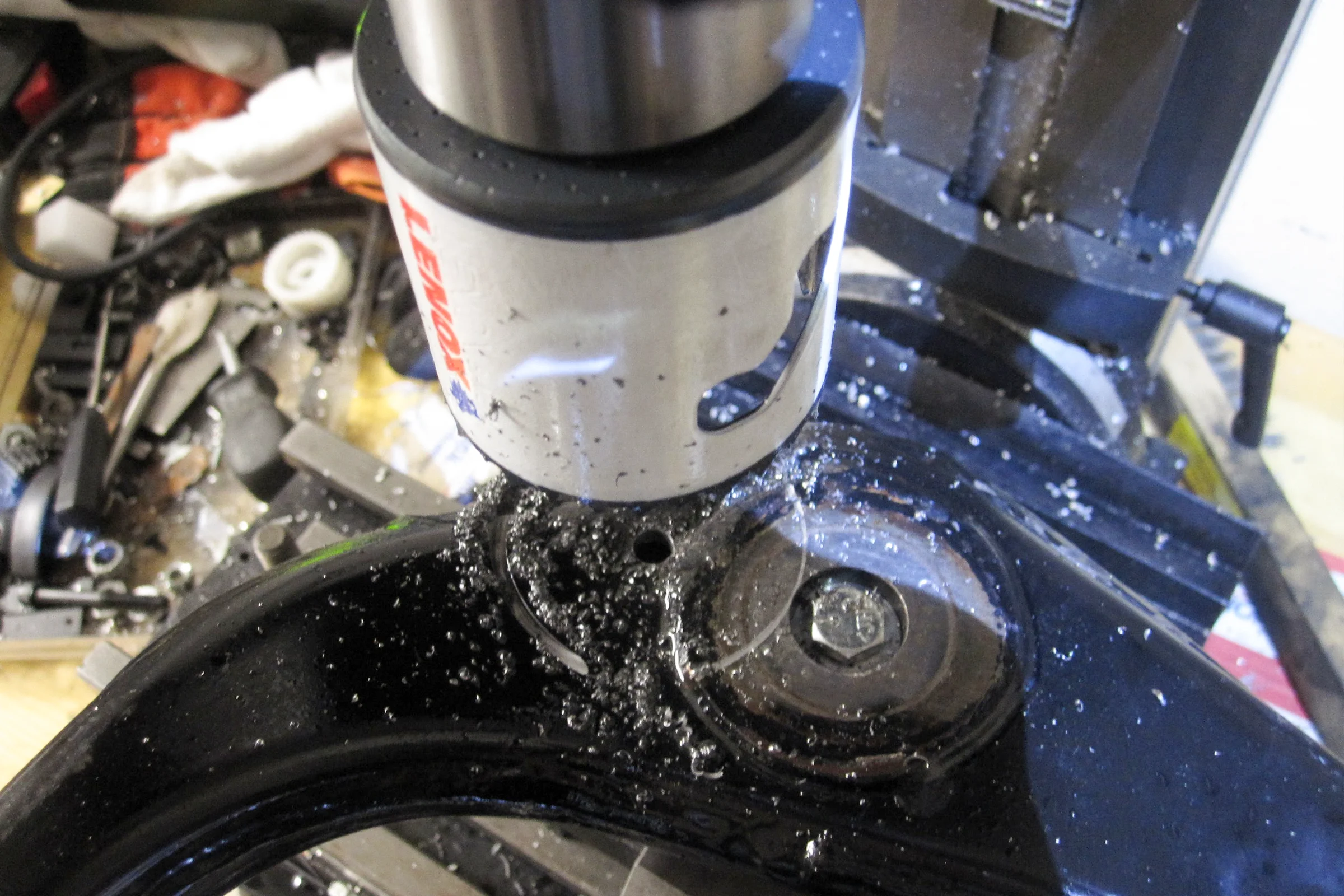 Suspension Geometry Correction — Milling corrected ball joint pocket in factory upper control arm at calculated angle and depth