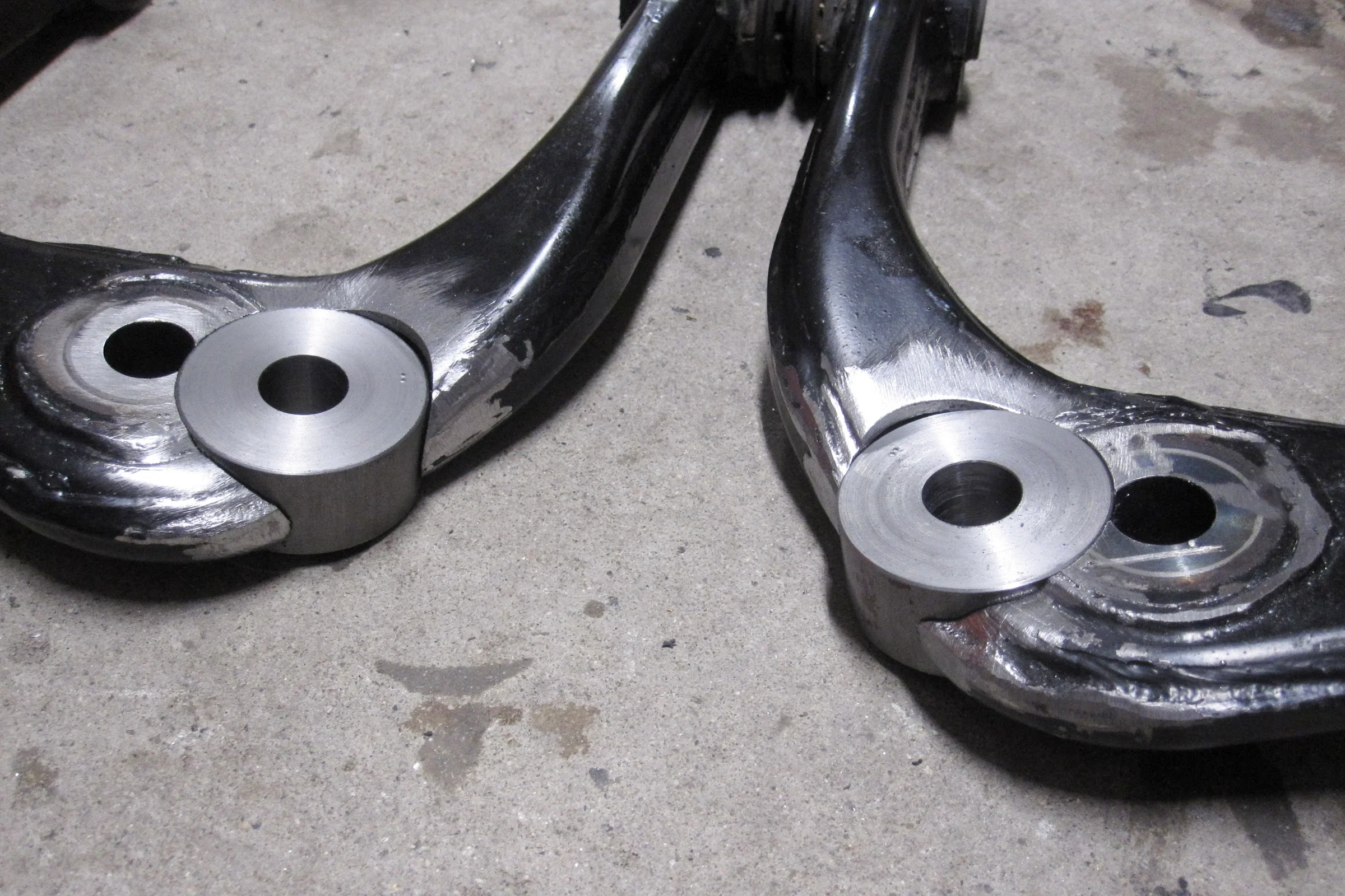 Suspension Geometry Correction — Finished lathe-turned ball joint coupling tapered to factory specification before welding into control arm
