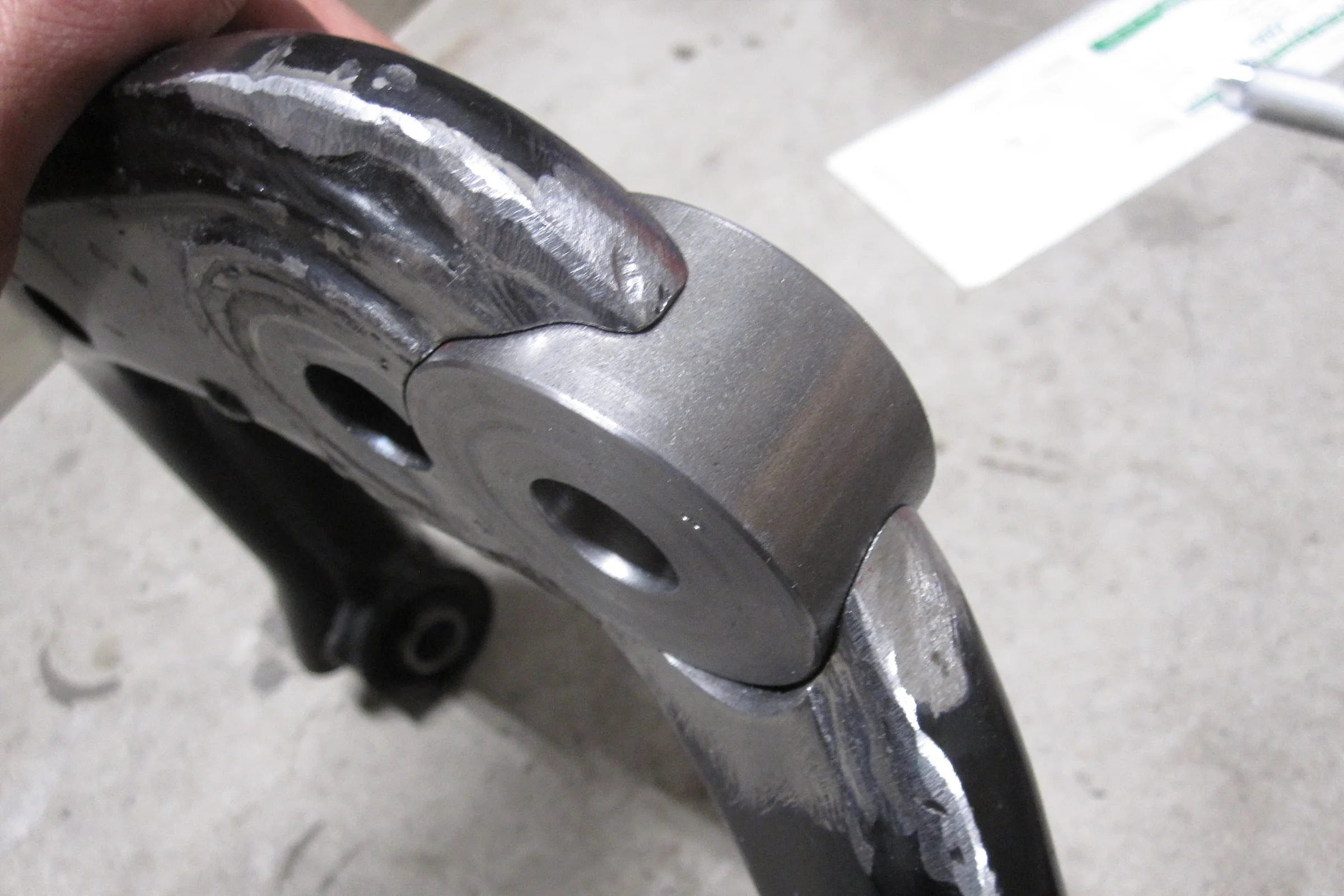 Suspension Geometry Correction — Modified upper control arm with new ball joint mount TIG welded into milled pocket