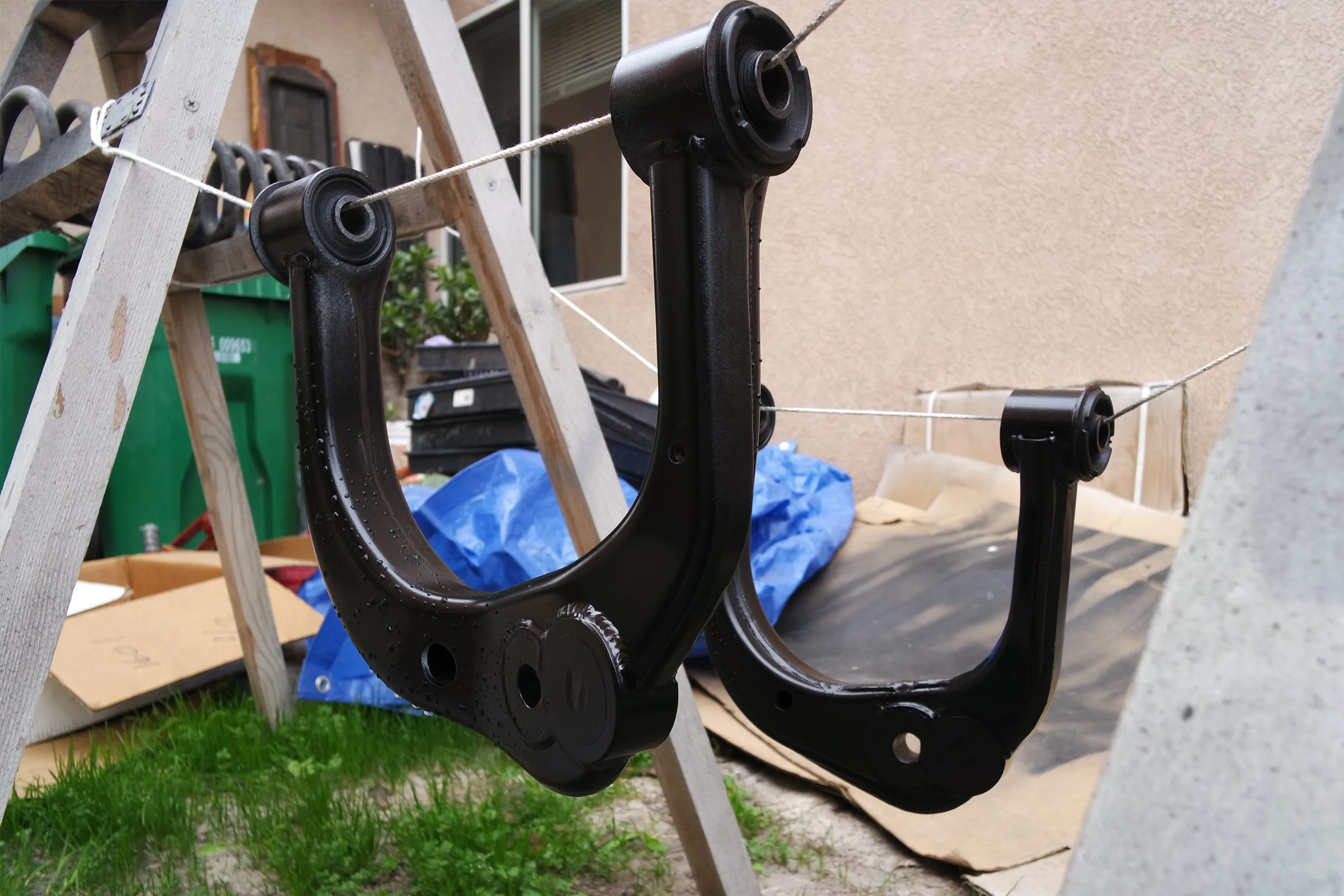 Suspension Geometry Correction — Modified upper control arm installed on Tacoma front suspension at corrected caster geometry