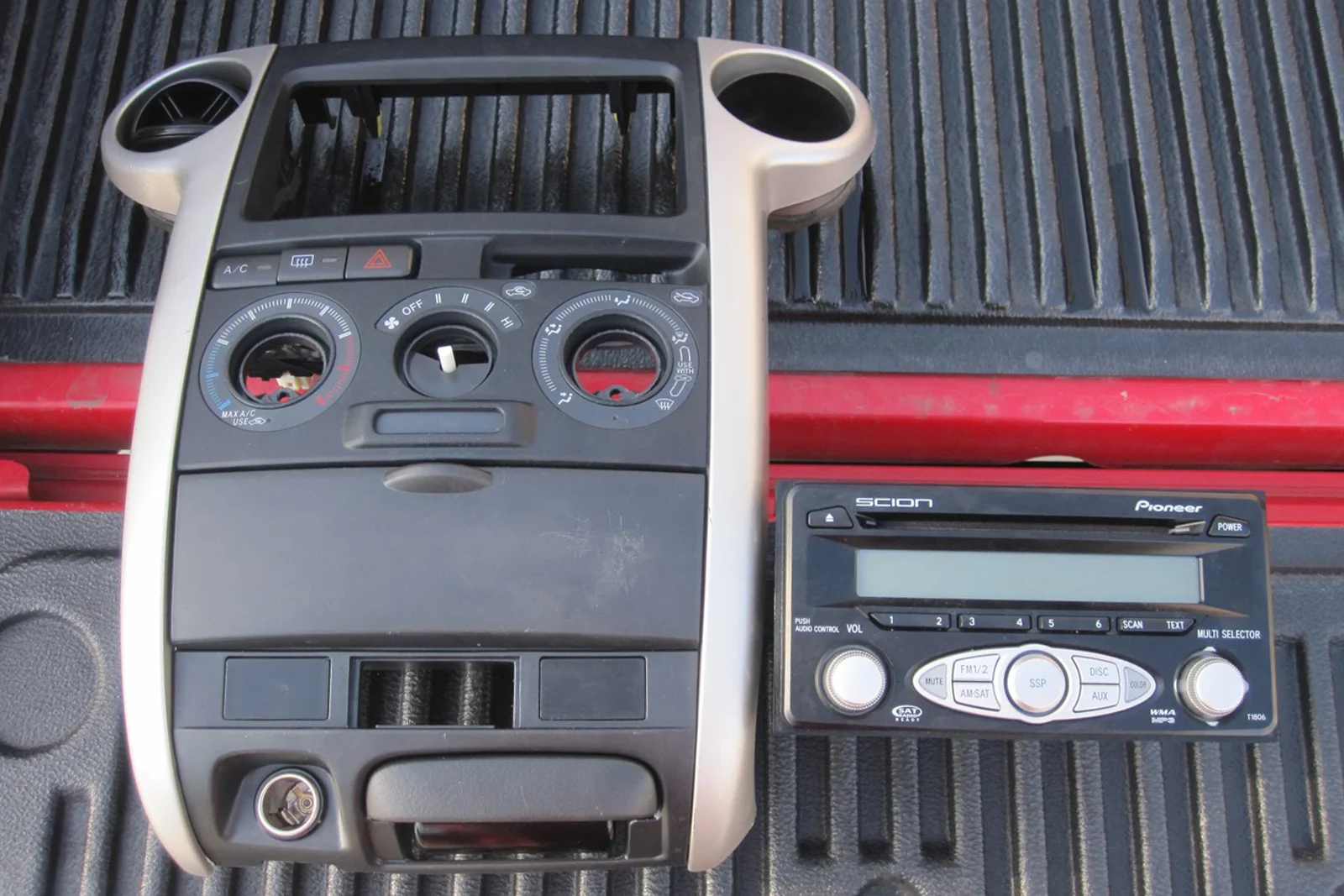Vehicle Integrated Compute — Factory Tacoma head unit PCB showing ribbon cable audio signal intercept point