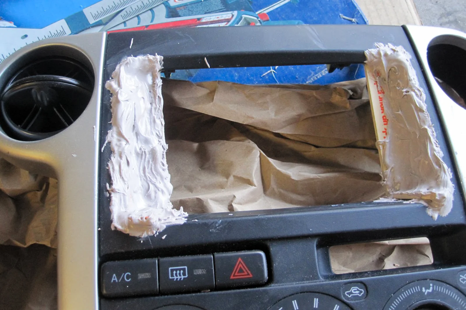 Vehicle Integrated Compute — Moto G phone disassembled with external button wiring and harness installed