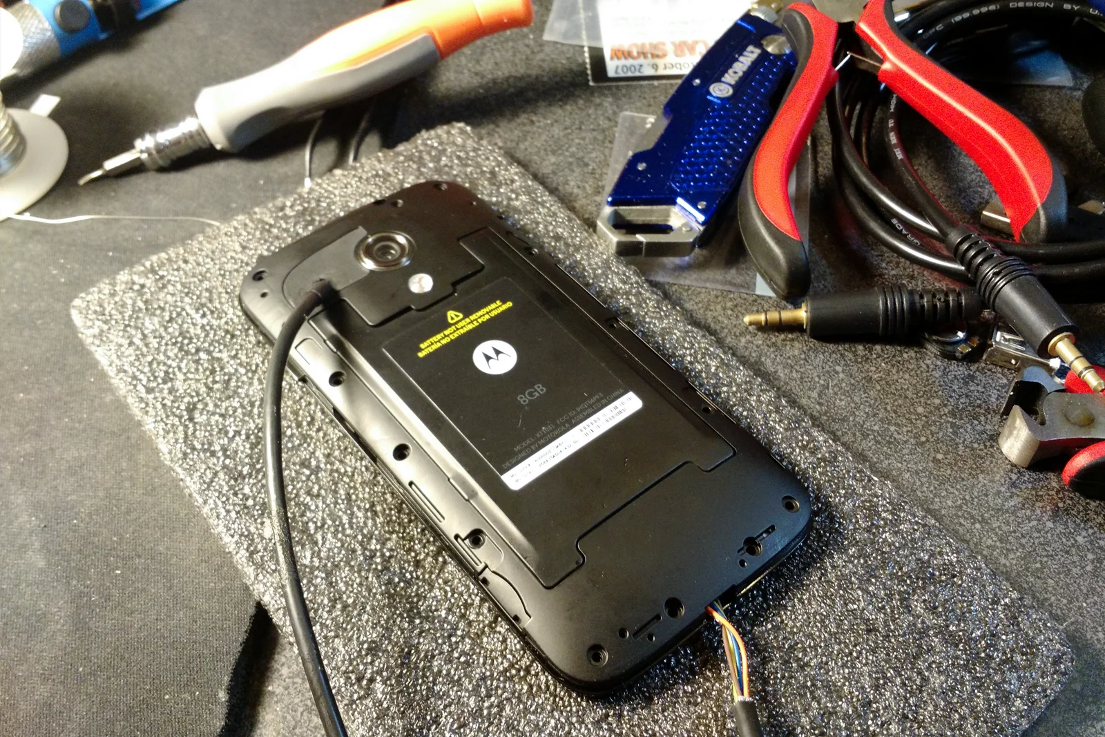 Vehicle Integrated Compute — Factory Tacoma head unit PCB showing ribbon cable audio signal intercept point