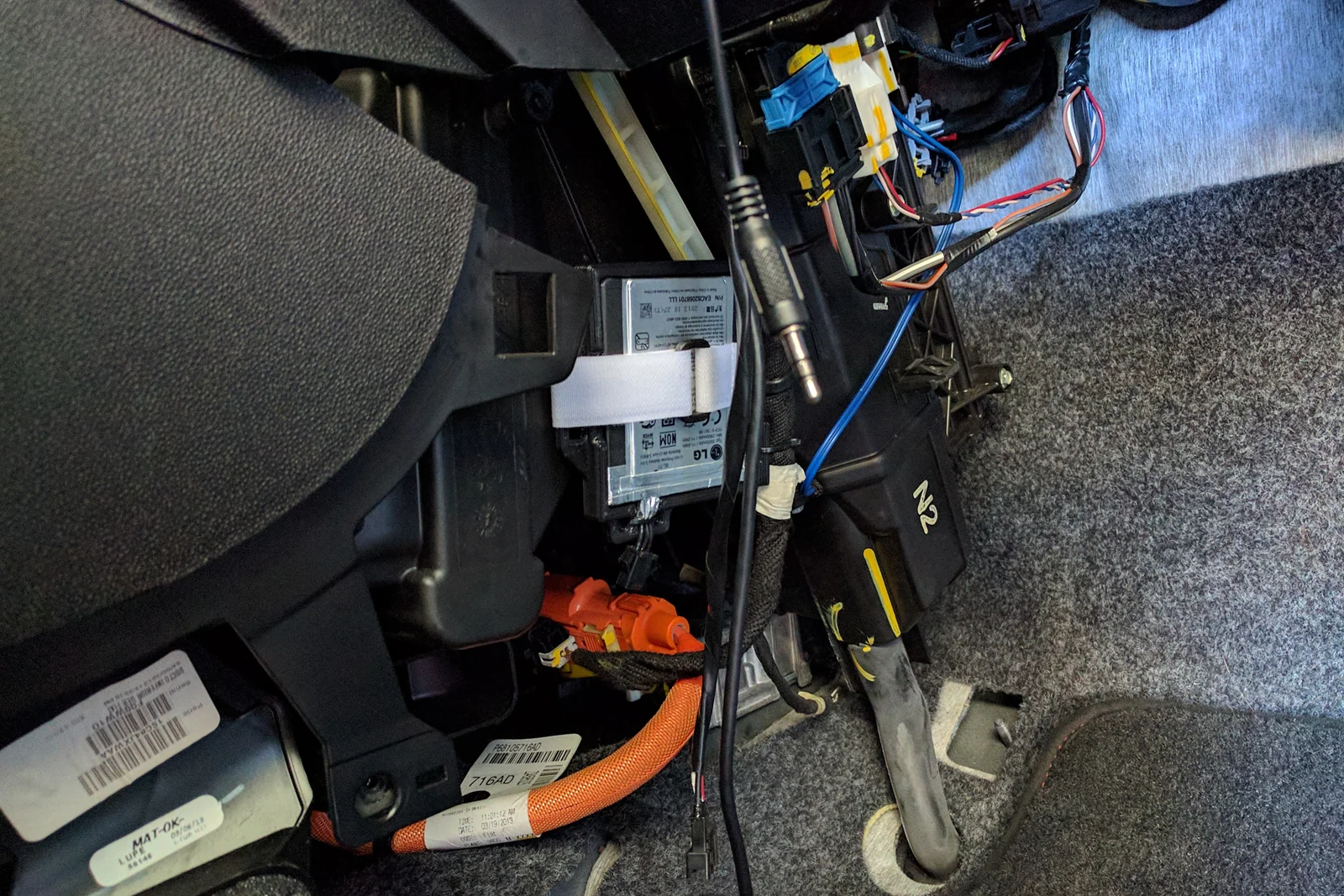 Vehicle Integrated Compute — Moto G phone disassembled with external button wiring and harness installed